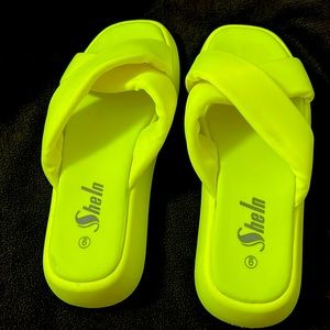 I am selling neon green slippers l. No tags but never worn